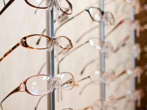 Eyeglasses on a shelf at Tacoma optical shop